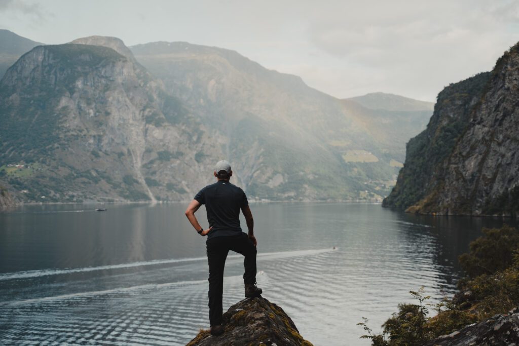 Man looking over fjords