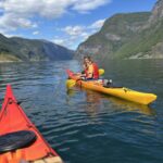 Happy Kayaker in Norwegian fjords